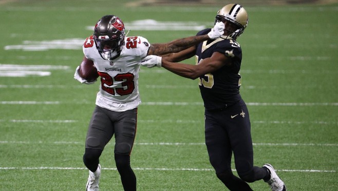 Tampa Bay cornerback Sean Murphy-Bunting stiffs arm New Orleans wide receiver Michael Thomas after hauling in interception during the Bucs’ 30-20 win over the Saints on Sunday. — Photo by CBS Sports